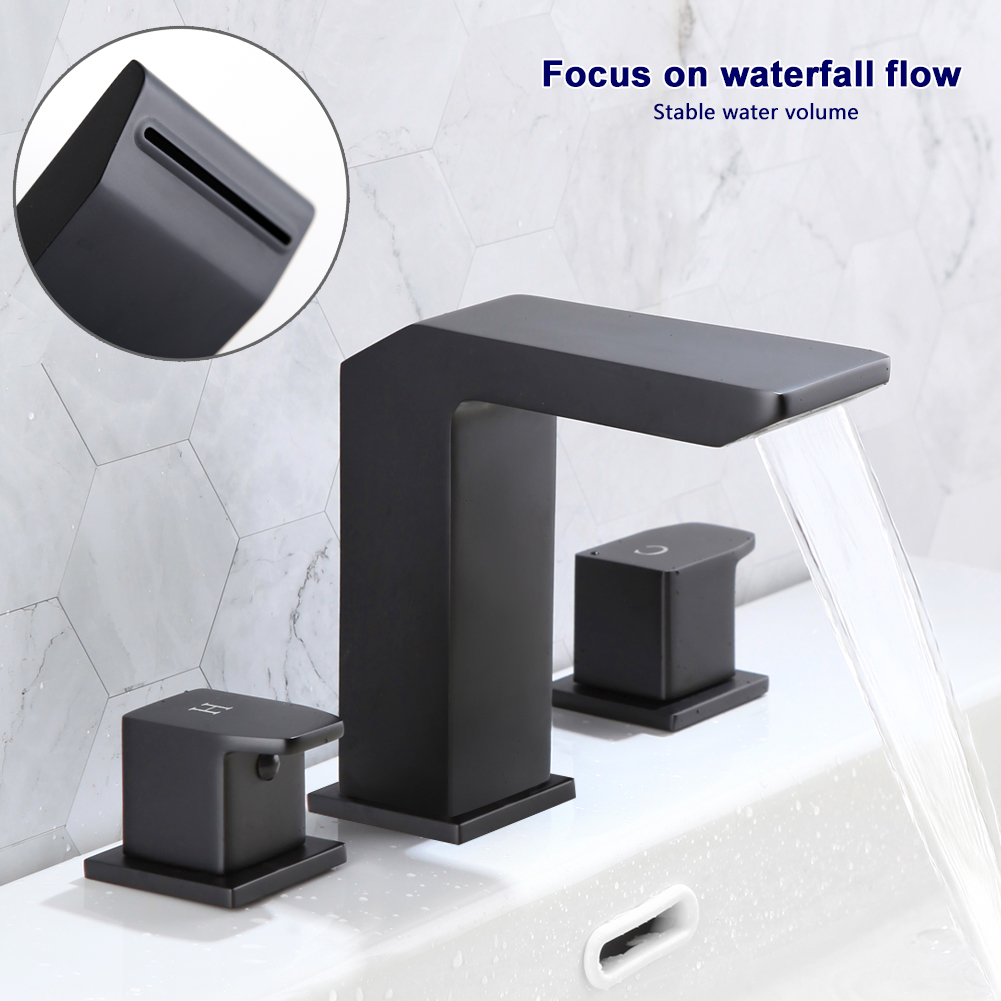 Matte black waterfall sink faucet showing water flow into a bathroom basin